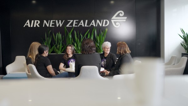 Women from Air NZ sitting around a table