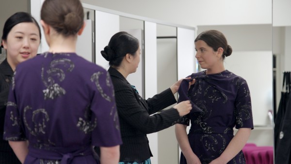 Lucy from Air NZ trying on a new uniform