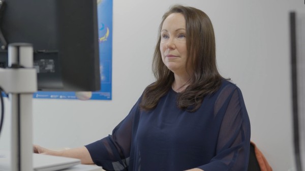 Image of Karen Aspey working at a computer