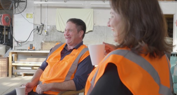 Image of Kirsty Brown and Daniel Batten laughing over a cup of tea