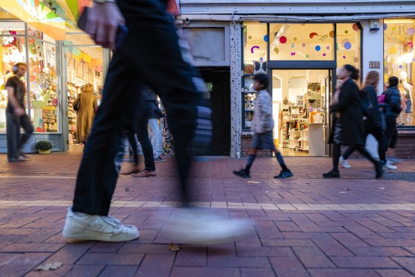 Blurred people walking on street